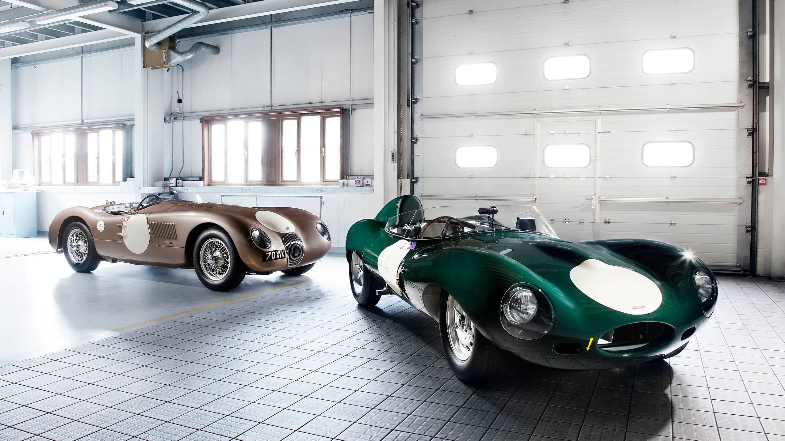 Two Classic Jaguar Parked at Plant