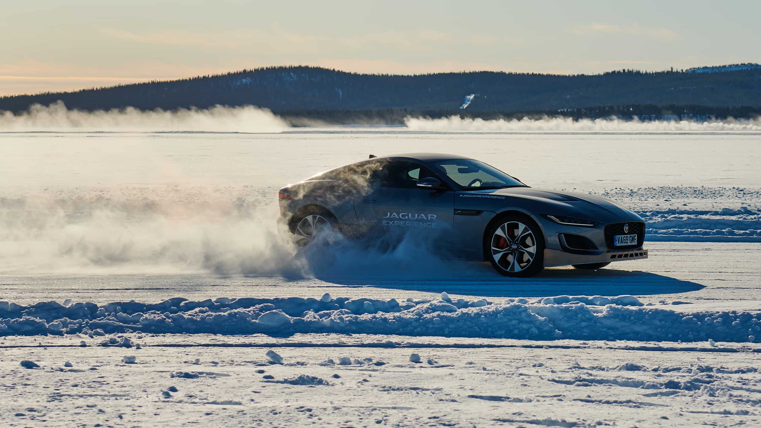 Jaguar FTYPE passes through a snowdrift and snowy land road