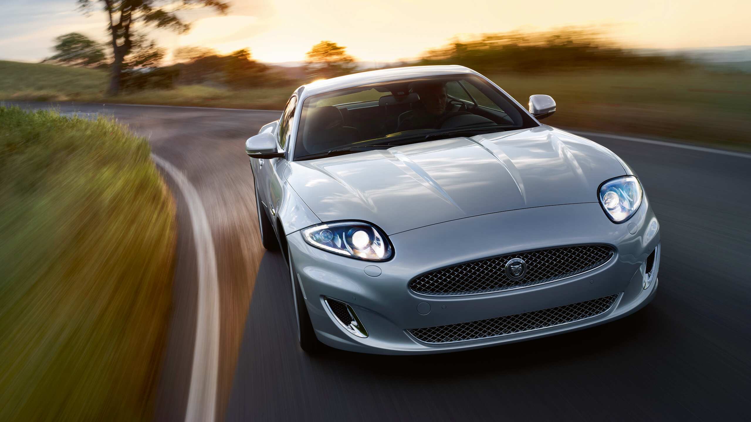 Jaguar XK speeding on the road